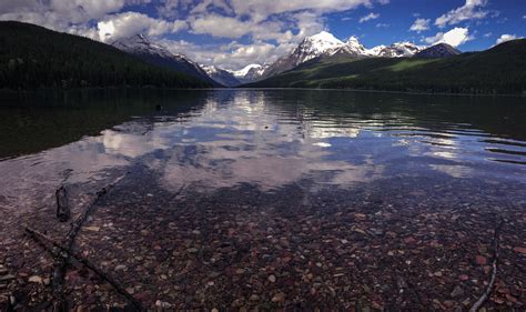 Dive into the Crystal Clear Waters: Discover the Pristine Beauty of a Lake