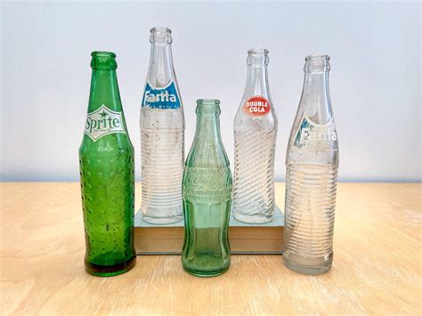 Dreams on the Rocks: Unraveling the Meanings of Glass Soda Bottles