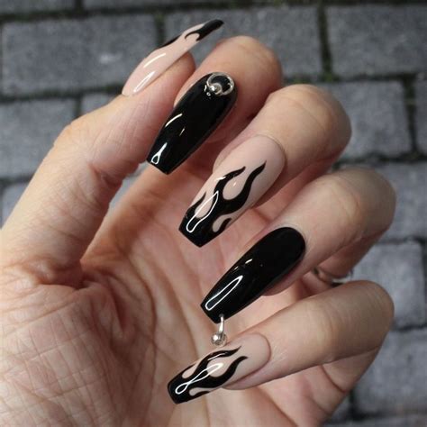 Edgy and Bold: Black Nail Designs with Metallic Details