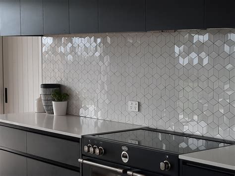 Enhancing Natural Light with Bright Walls and Reflective Backsplash