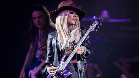 Exploring Orianthi's Unique Style and Physique