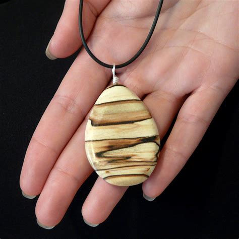 The Enchanting Universe of Unique Handcrafted Wooden Pendants