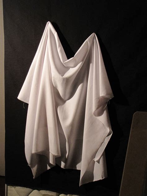 The Symbolism of a Figure Draped in White: Significance and Analysis