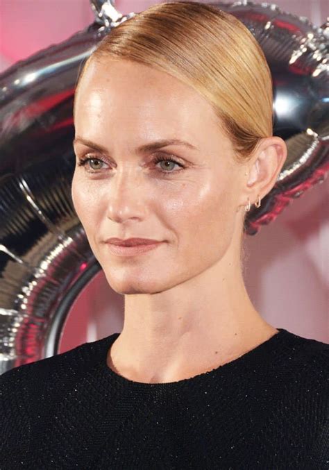 Unveiling Amber Valletta's Height and Fashionable Figure