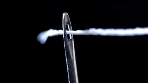 Unveiling the Symbolic Significance of Successfully Threading a Needle