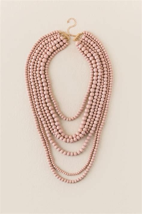 Unveiling the Symbolism of the Blush Bead Necklace